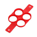 Forma de panqueca de silicone vermelha com quatro aberturas circulares.